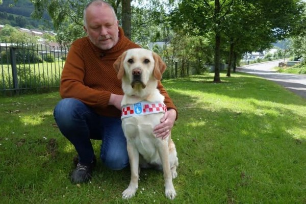 A photo of me with Sophie wearing her red and white harness; by kind permission of Deborah Rees of Guide Dogs Cymru